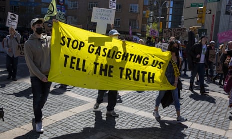 Extinction Rebellion NYC display a ‘gaslighting’ banner at a Tell The Truth March in New York in April.