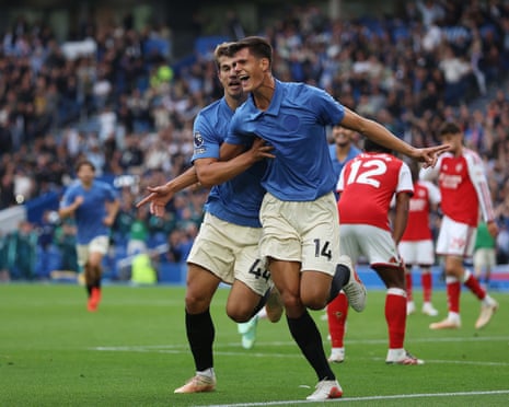 Chema Andres and Luka Vuskovic of Brighton celebrate a goal, arms outstretched, against Arsenal