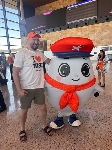 A passenger with the Jetstar mascot.