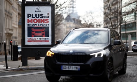SUV drives past poster asking, ‘More or fewer SUVs in Paris?'