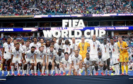 England players pose on the podium during the medal ceremony