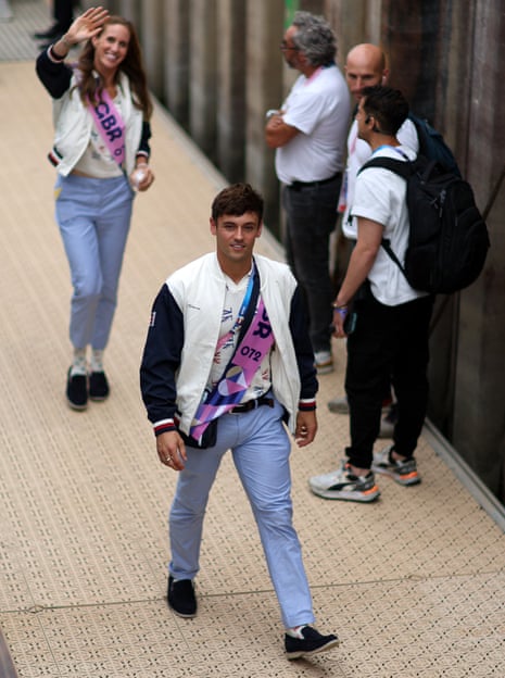 Tom Daley and Helen Glover before carrying the GB flag.