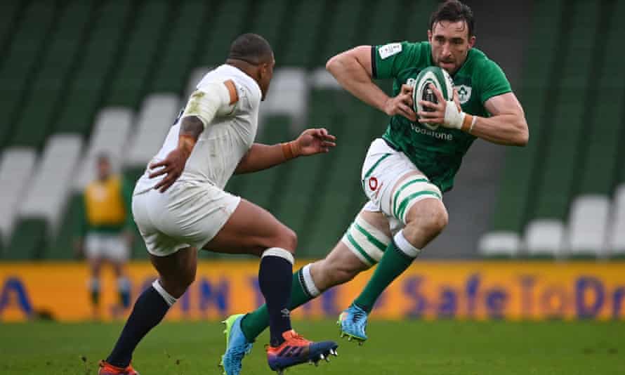 Jack Conan, one of Ireland's try scorers, makes a powerful run against England mainstay Kyle Sinckler.