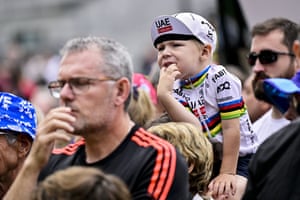 A young fan of Tadej Pogacar is pictured at the start of stage 14