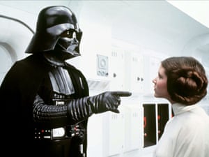David Prowse as Darth Vader and Carrie Fisher as Princess Leia in a scene from Star Wars: Episode IV – A New Hope