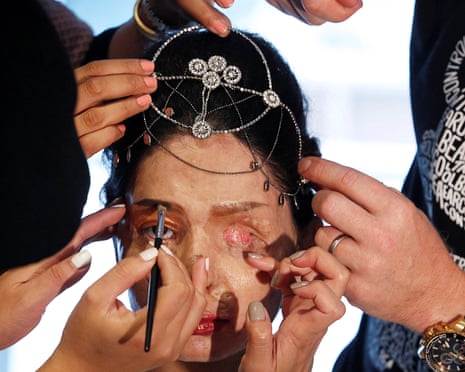 Indian model and acid attack survivor Reshma Qureshi has makeup applied before modelling designs by Archana Kochhar during New York Fashion Week.