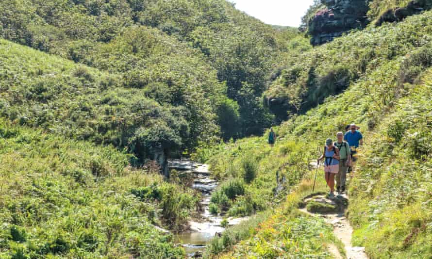 Group of hikers walking near Tintagel, Cornwall.