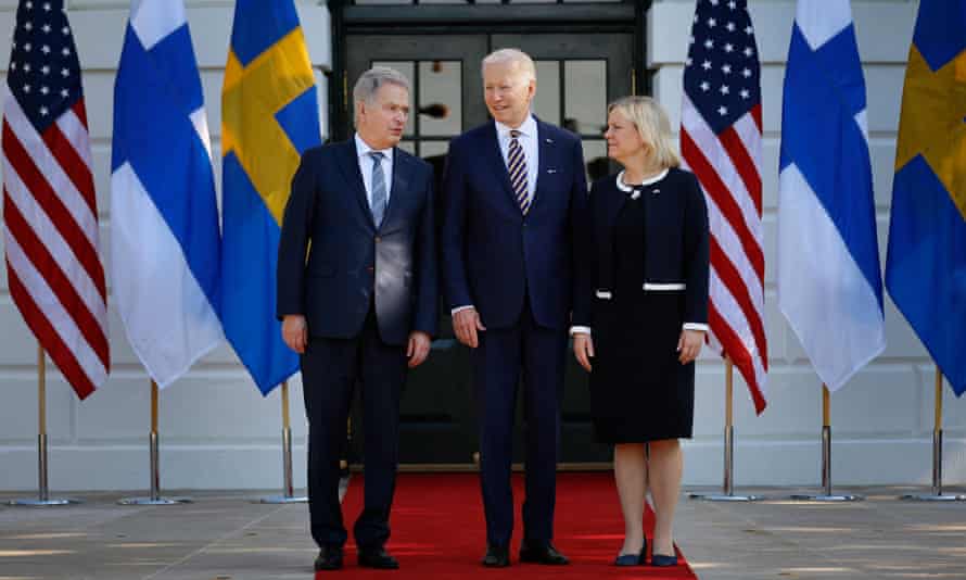 US President Joe Biden (C), Sweden’s prime minister Magdalena Andersson (R) and Finland’s President Sauli Niinistö pose for photographs after the European leaders arrived at the White House.