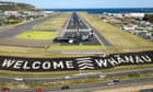 New Zealand airport worker tests positive to Covid on second day of travel bubble