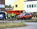 Police and emergency personnel outside the Brinell school in Fagersta, Sweden, after a 17-year-old girl was killed and several people were injured in a sword attack.