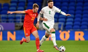 Matt Doherty holds off Wales’s Rhys Norrington-Davies on Sunday.