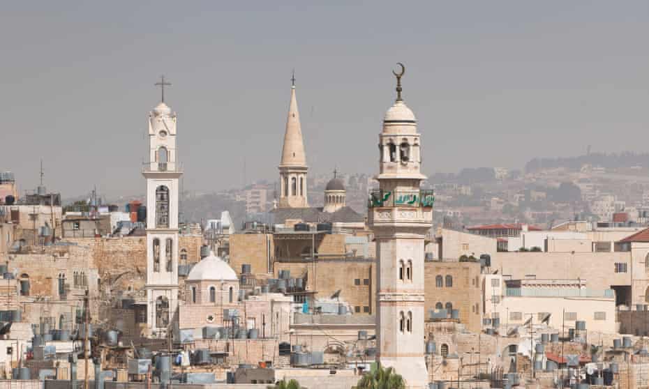 Skyline of Bethlehem, with a mosque’s minaret and various churches, West Bank, Palestine
