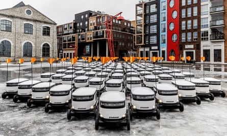 A fleet of robots from Starship Technologies wait in a square in Tallinn, Estonia.