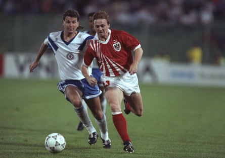 Andreas Ogris runs distant from a defender en way to scoring for Austria successful their 1990 World Cup lucifer against USA successful Florence.