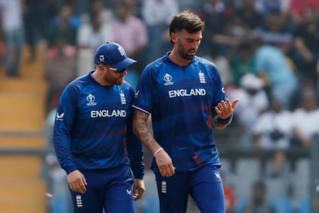 Topley with Bairstow after sustaining an injury.
