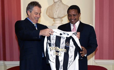 Tony Blair handing a signed Newcastle United shirt to Jakaya Kikwete, then president of Tanzania, in 2007.