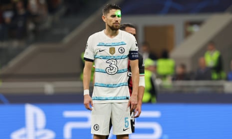 Chelsea's Jorginho has a green laser pointed at his face as he takes a penalty