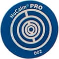 a nucalm sticker - blue, round shape with circles on it that says ‘nucalm pro 002’