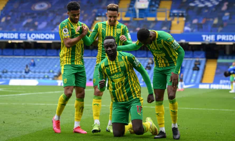 West Bromwich Albion’s Mbaye Diagne celebrates scoring their fourth goal with teammates.