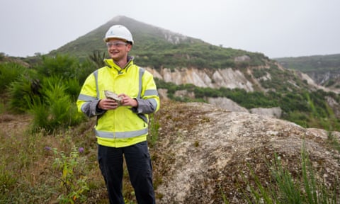 Geologist James Pearson holds a rock at Trelavour quarry near St Austell, Cornwall.