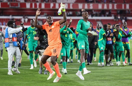 Édouard Mendy and Nicolas Jackson of Senegal celebrate after their historic victory of England.