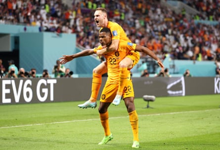 Denzel Dumfries of the Netherlands celebrates after a goal at the 2022 World Cup.
