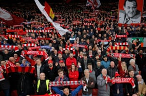 Fans on the Kop sing You’ll Never Walk Alone before Liverpool’s Premier League match against Huddersfield at Anfield in April 2019.