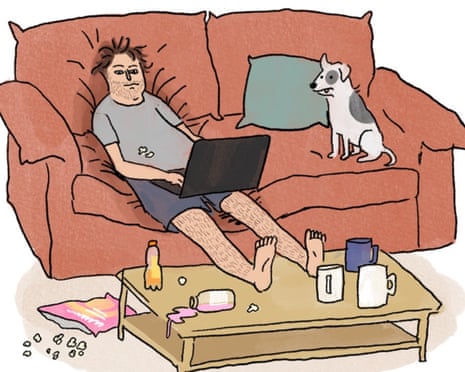 Someone lying on their sofa with a laptop, with their feet up on a coffee table covered in mugs, drinks bottles and crisps, with a dog next to them