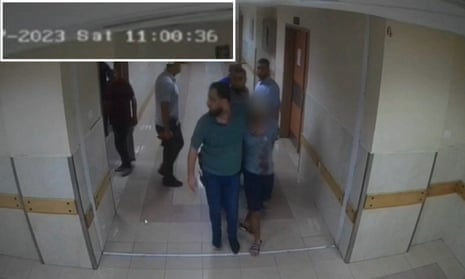 Security camera footage released by the Israeli army showing what it says is Hamas fighters leading hostages into al-Shifa hospital on 7 October