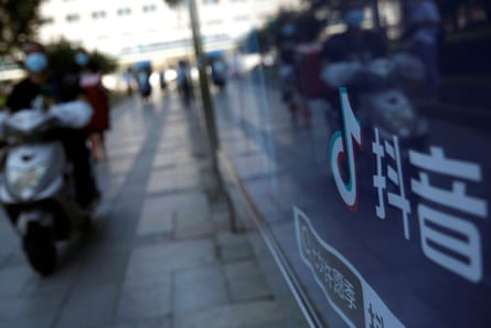 A TikTok logo is seen on an advertising board at a bus stop in Beijing, China.