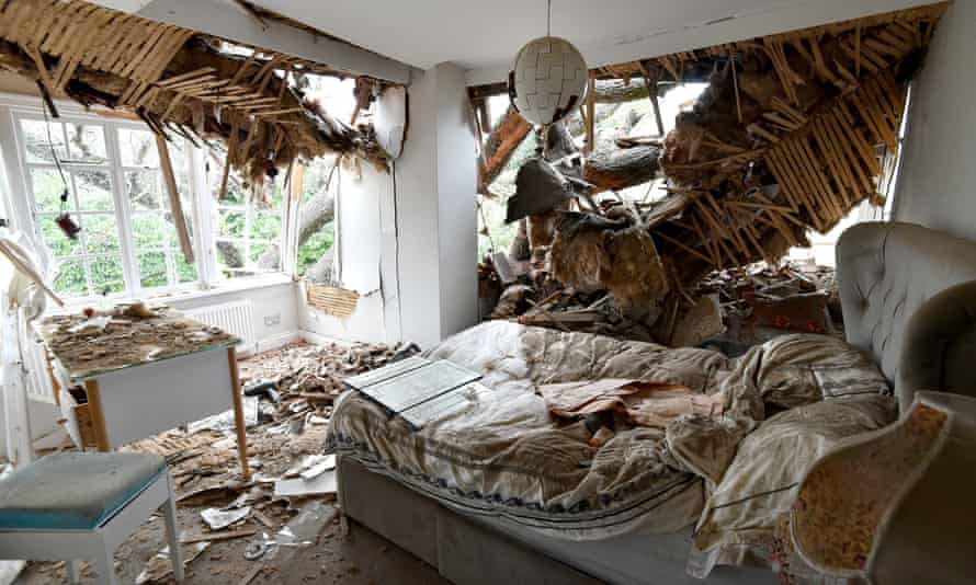 One of the bedrooms at home after a huge oak tree crashed through the roof.