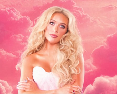 Woman in front of pink clouds