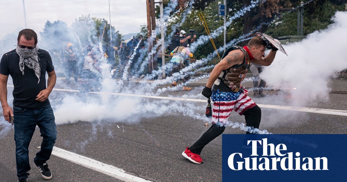Hundreds clash in Portland as Proud Boys rally descends into violence