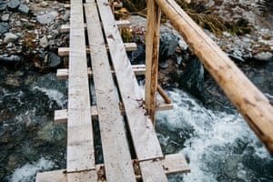A simple wooden bridge over a brook