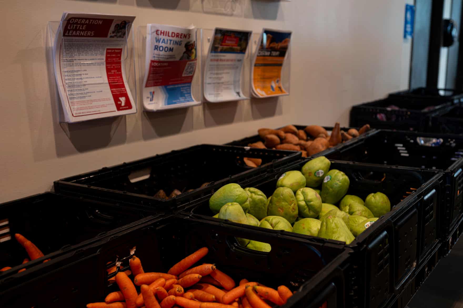 Flyers hanging above crates of producer