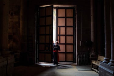 Cardinal Pizzaballa walks through a large door