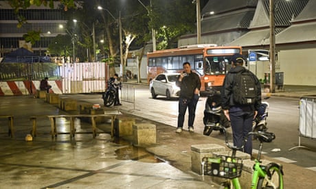 Thailand’s Central Investigation Bureau (CIB) members stand near the spot where a Cambodian MP was reportedly shot, in Bangkok on 7 January, 2025.