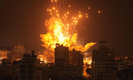 A missile explodes in Gaza City during an Israeli air strike
