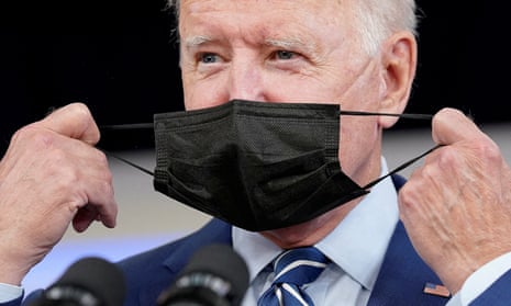 Joe Biden puts on a Covid mask
