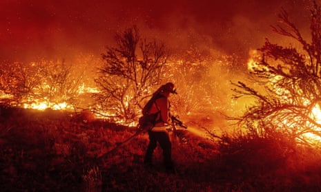 A firefighter battles the Dixie fire in California, which was exacerbated by arson. Most wildfires though, are not set by arsonists. 