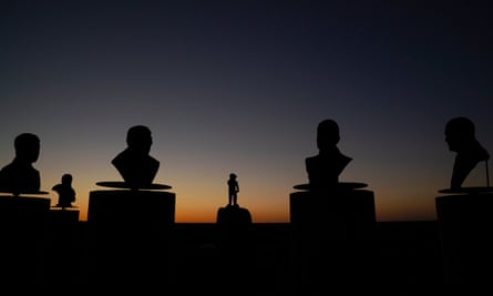Monument Hill in Orania. Busts of former presidents of the town surround the statue of town mascot De Kleine Reus (The Little Giant), a young boy rolling up his sleeves