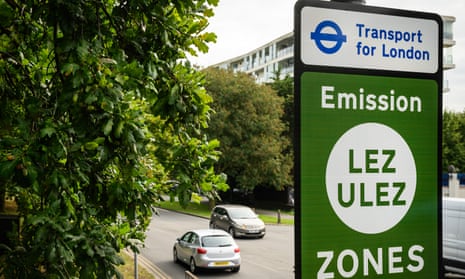 A photo of vehicles passing by a sign indicating the new boundary of the LEZ and ULEZ expansion on 29 August.