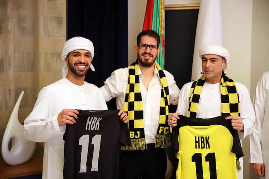 Sheikh Hamad bin Khalifa Al Nahyan, right, and his son Mohamed with Moshe Hogeg, Beitar’s owner, at the signing of the deal.