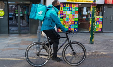 A deliveroo cyclist seen on empty streets in Brick Lane, east London