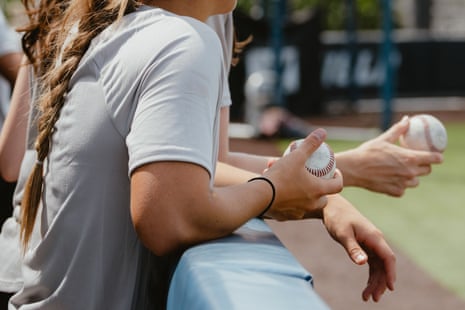 Players hold baseballs