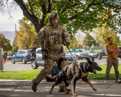 A police officer walks with a K9 Unit following the shooting of Charlie Kirk, the CEO and co-founder of the conservative youth organization Turning Point USA, at Utah Valley University in Orem, Utah, USA.