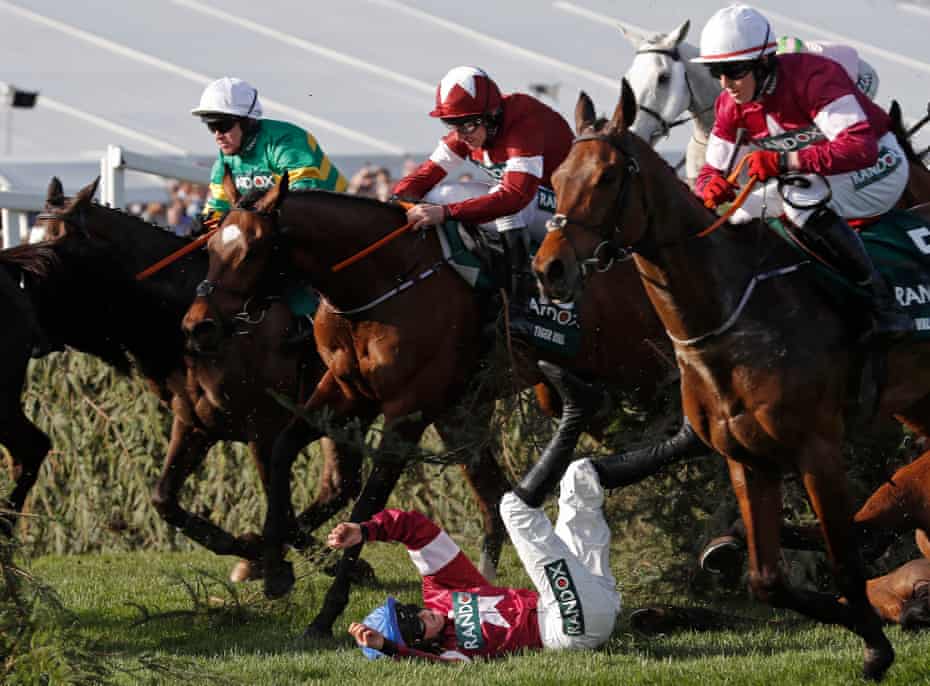 Rachael Blackmore falls off Alpha Des Obeaux at the Chair fence, just in front of eventual winner Tiger Roll, during the 2018 Grand National.