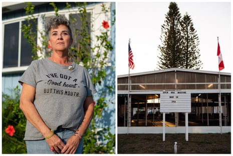 woman in a grey t-shirt on the left and a clubhouse on the right.