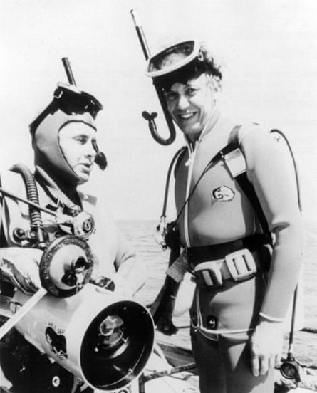 Black and white photo of David Attenborough ( right) and another man in diving gear, wearing snorkels and masks