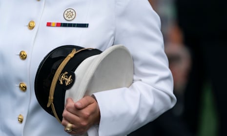 An unidentified midshipman holds his US Capitol during the United States naval academy class of 2021 graduation in Annapolis, Maryland, on 28 May.